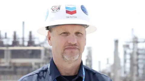 James Cooke/BBC Chevron director Tim Potter looks at the camera while wearing a hard hat