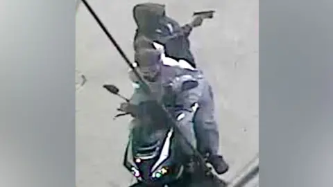NYPD CCTV footage of the two suspects on a moped.