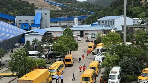 Getty Images Rescuers carry out search and rescue operations at the site of the Liushenyu coal mine on May 23, 2026 in Qinyuan County, Changzhi City, Shanxi Province of China. 