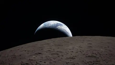 NASA via Getty Images Earthset captured through the Orion spacecraft window