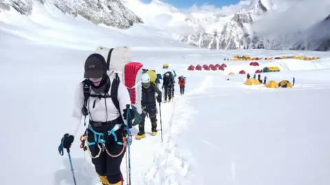 Reuters Members of an expedition team head to Camp 2 from Camp 1 during their rotation trip in the Solukhumbu district early in May