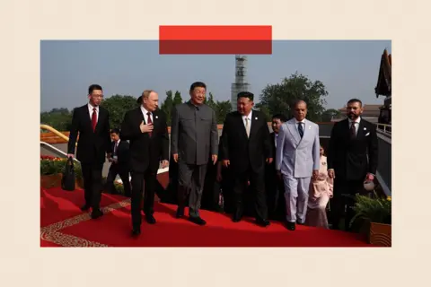 Kremlin Press Office/Anadolu via Getty Images) China's President Xi Jinping (C), North Korea's leader Kim Jong Un (3rd R) and Russia's President Vladimir Putin (2nd L) arrive for a reception in the Great Hall of the People