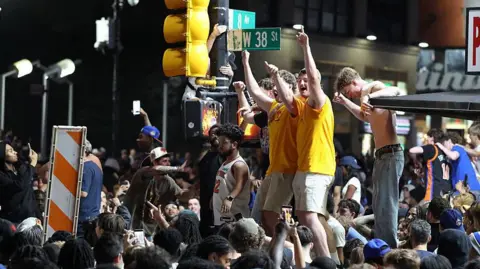 Getty Images New York Knicks fans celebrate outside Madison Square Garden after their team's Game 4 victory.