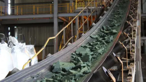 Getty Images A conveyor belt moves raw cobalt for processing at the Etoile mine in the Democratic Republic of Congo