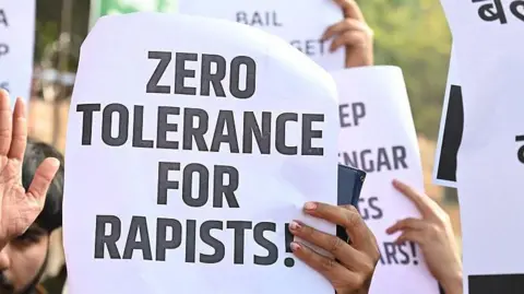 Getty Images A group of women activists gather at Jantar Mantar in protest to oppose the conditional bail granted to former Uttar Pradesh MLA Kuldeep Singh Sengar in the Unnao rape case, on December 28, 2025 in New Delhi, India. 
