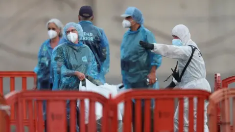 Reuters US passengers from the MV Hondius cruise ship are instructed by authorities after disembarking the vessel in Tenerife, Spain. Photo: 10 May 2026