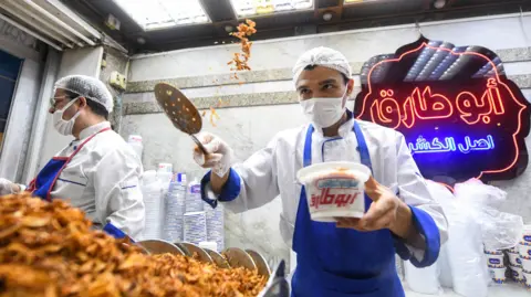 Getty Images An Egyptian chef prepares a traditional dish in Arabic known as Koshary at Abou Tarek restaurant downtown Cairo 