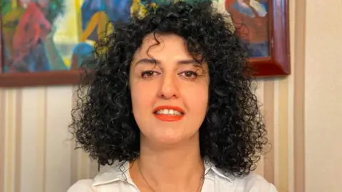 Reuters Undated picture of Narges Mohammadi provided by her family, showing smiling with uncovered hair