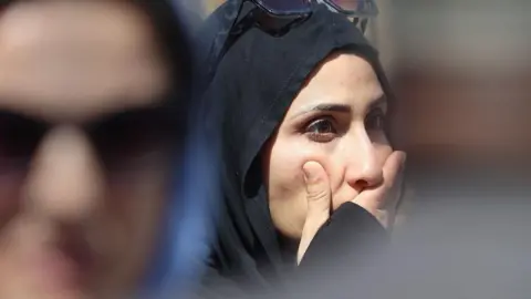 EPA Rema Abedkader reacts after the mosque shooting in San Diego, California, on 18 May 2026