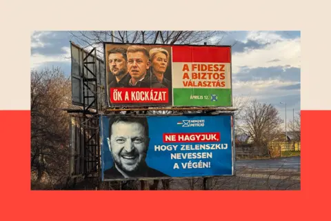 NurPhoto via Getty Images Two posters are displayed on a street: the top one shows Zelensky, Magyar and Ursula von der Leyed, and the bottom one shows Zelensky smiling 