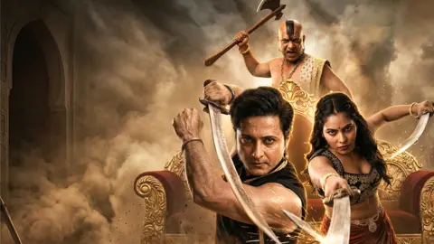 Kuku TV A poster showing three people - a man wearing a black vest and holding a sword, a woman in a black embellished blouse holding a sword with both hands, and behind them, a bald man with a strip of hair holding an axe. In the background, there is a red and gold couch and a duststorm