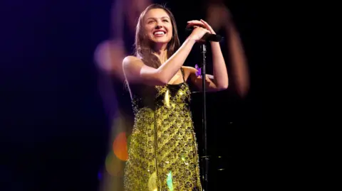 Getty Images Olivia Rodrigo on stage in New York in 2025