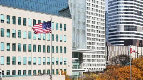 Getty Images A US flag outside the consulate building in Toronto