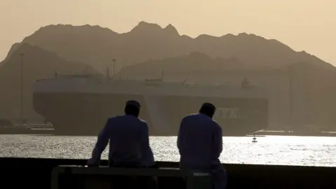Getty Images Ships wait in the Gulf of Oman as the Strait of Hormuz has continued to block traffic