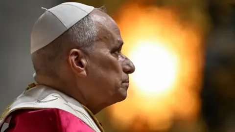 EPA Head shot of Pope Leo, facing right and wearing a papal cap and robes