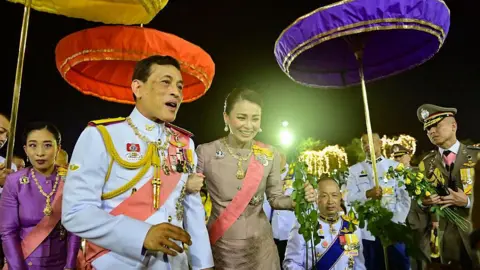 Getty Images Thailand's King Vajiralongkorn and Princess Bajrakitiyabha (L) greet supporters in Bangkok on October 23, 2020.