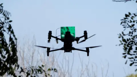 Sergey Shestak/EPA A Ukrainian FPV drone flies before an attack mission on a frontline in the Donetsk region in Ukraine