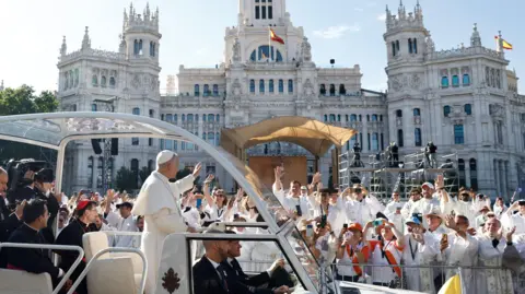 EPA/Shutterstock Pope Leo XIV waves to faithful from his popemobile