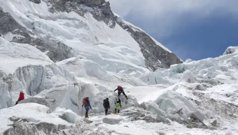 Purnima Shrestha Photo showing five climbers practising at Khumbu Icefalls area before Camp I. 