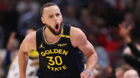 Getty Images Stephen Curry of the Golden State Warriors celebrates a three pointer against the Chicago Bulls during the second half at the United Center in Chicago