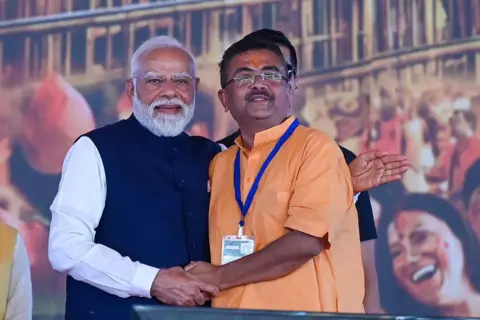 Hindustan Times via Getty Images Prime Minister Narendra Modi warmly hugged West Bengal Chief Minister Suvendu Adhikari after the swearing-in ceremony at Brigade Parade Ground, on May 9, 2026 in Kolkata, India. 