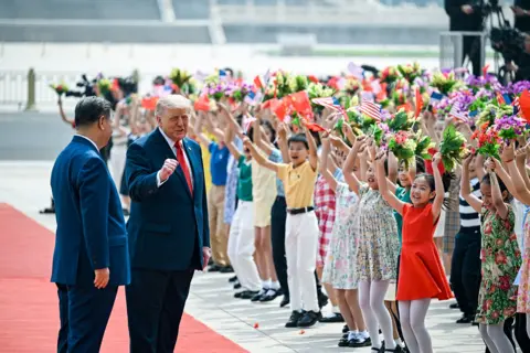 Reuters The scene as U.S. President Donald Trump participates in events at the Great Hall of the People and does a greeting with the President of the People’s Republic of China Xi Jinping May 14, 2026
