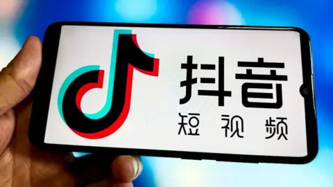 Getty Images Logo of short video app Douyin on phone screen.