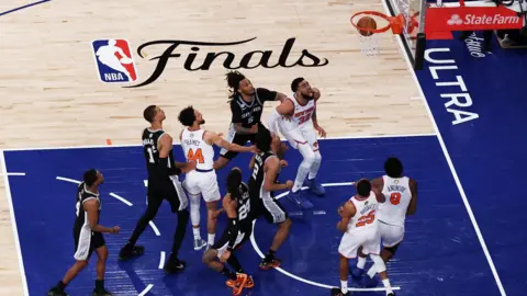 Reuters Knicks forward OG Anunoby (8) makes a game-winning tip shot against San Antonio Spurs guards Dylan Harper (2) and Devin Vassell (24) during game four of the 2026 NBA Finals