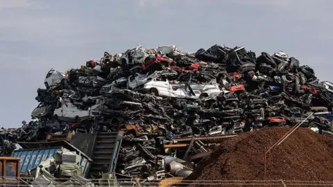 Getty Images Scrapped vehicles at a scrap and metal recycling yard in Wilhelmshaven, Germany, on Friday, May 2, 2025