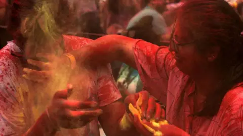 Getty Images Youngsters smeared with coloured powder to celebrate Holi, the Festival of Colours, at Nerul , on March 14, 2025 in Navi Mumbai, India.
