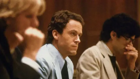Getty Images (Original Caption) Miami, FLA.: Theodore Bundy, seated in court, charged with the killings of two FSU coeds.
