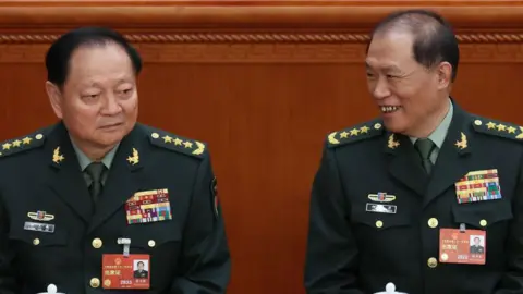 Getty Images Zhang and He at the 2023 NPC session 