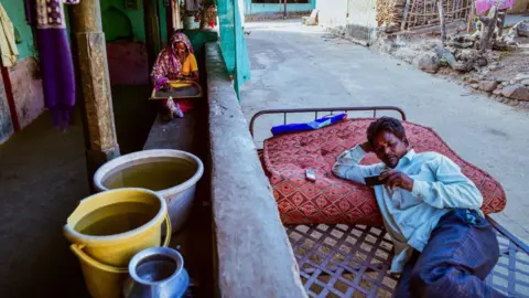 Getty Images Containers of water drawn from a partially dried up well sit in a house on May 26, 2023 in Khokher Viheer village, Peth Taluka, Nashik, Maharashtra.