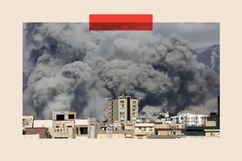 Getty Images Smoke rises from the area after it was targeted in attacks in Tehran