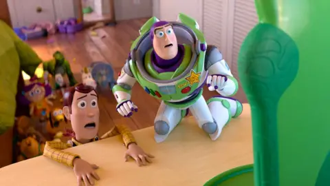 Disney Woody and Buzz Lightyear looking scared of the digital tablet known as Lilypad