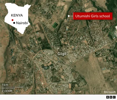 Satellite map showing the town of Gilgil in Kenya with surrounding roads, buildings, and farmland. A label marks “Utumishi Girls school” on the northeastern edge of the town. An inset map in the top left shows Kenya with Nairobi highlighted to indicate location. The main map labels “Gilgil” at the centre, with a scale bar showing 1 km / 2,000 ft. The image is credited to Microsoft with BBC branding.