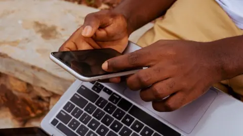 Getty Images Person using a phone