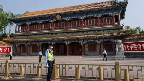 Getty Images Security stand guard outside Zhongnanhai, the official residence of China's leadership, on May 13, 2026 in Beijing, China.