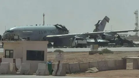 Facebook a large grey aircraft with US Air Force markings is shown with a large part of its middle section missing and its tail at an angle.