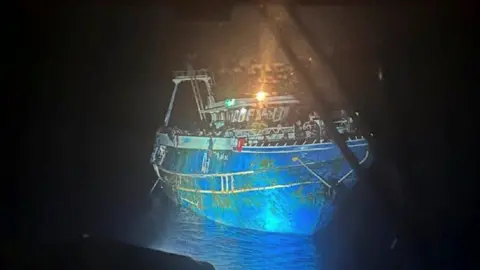 Greek Coast Guard The boat under search lights