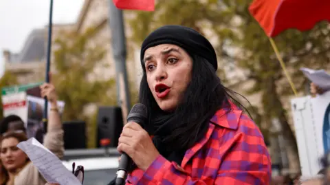 EPA-EFE/REX/Shutterstock Marjane Satrapi participates in a rally in support of Iranian women in Paris, France, 2 October 2022.
