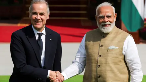 Reuters Canada's Prime Minister Mark Carney shakes hands with his Indian counterpart, Narendra Modi, before their meeting at Hyderabad House in New Delhi, India, March 2, 2026.