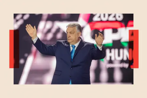 AFP via Getty Images Orban stands on a stage in front of the CPAC logo. He is wearing a dark blue suit and a light blue tie 