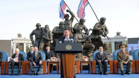 Reuters via KCNA Kim Jong Un at the opening ceremony of a memorial for North Korean troops killed while fighting in the war against Ukraine