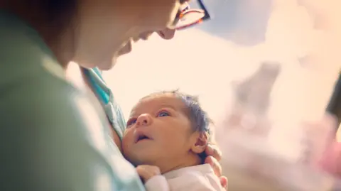 Getty Images A woman and her baby