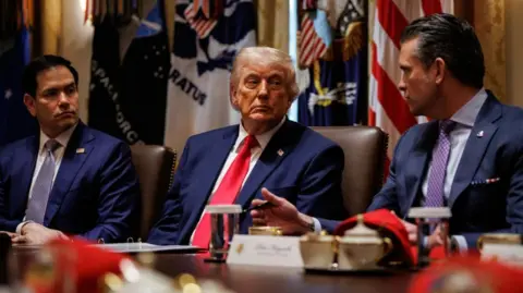 EPA Marco Rubio, Donald Trump and Pete Hegseth during a cabinet meeting