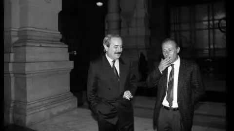 Getty Images Italian magistrates Giovanni Falcone and Paolo Borsellino during a break at the Palace of Justice