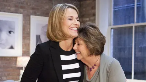 Reuters Savannah Guthrie (left) embraces her mother, Nancy Guthrie (right)