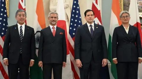 AFP via Getty Images US Secretary of State Marco Rubio (2R) stands alongside Indo-Pacific Quad ministers, L-R, Japanese Foreign Minister Iwaya Takeshi, Indian Foreign Minister Subrahmanyam Jaishankar and Australian Foreign Minister Penny Wong, during a photo opportunity before meetings at the State Department in Washington, DC, on January 21, 2025. 