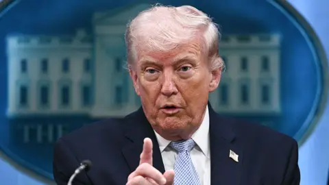 AFP via Getty Images Donald Trump speaks about the conflict in Iran in the Press Briefing Room of the White House on 6 April 2026, in Washington DC.